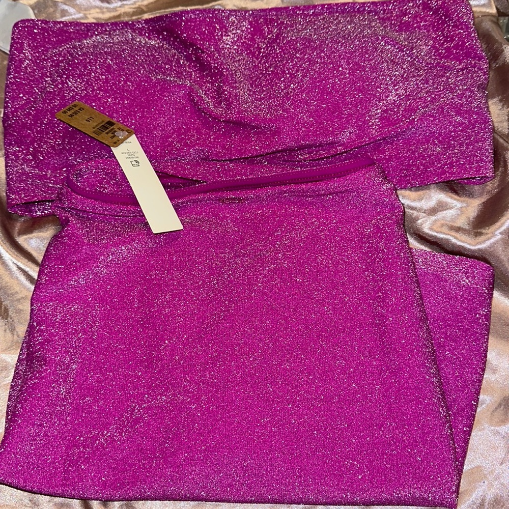 Pink shimmery bikini top and skirt by Victoria’s Secret